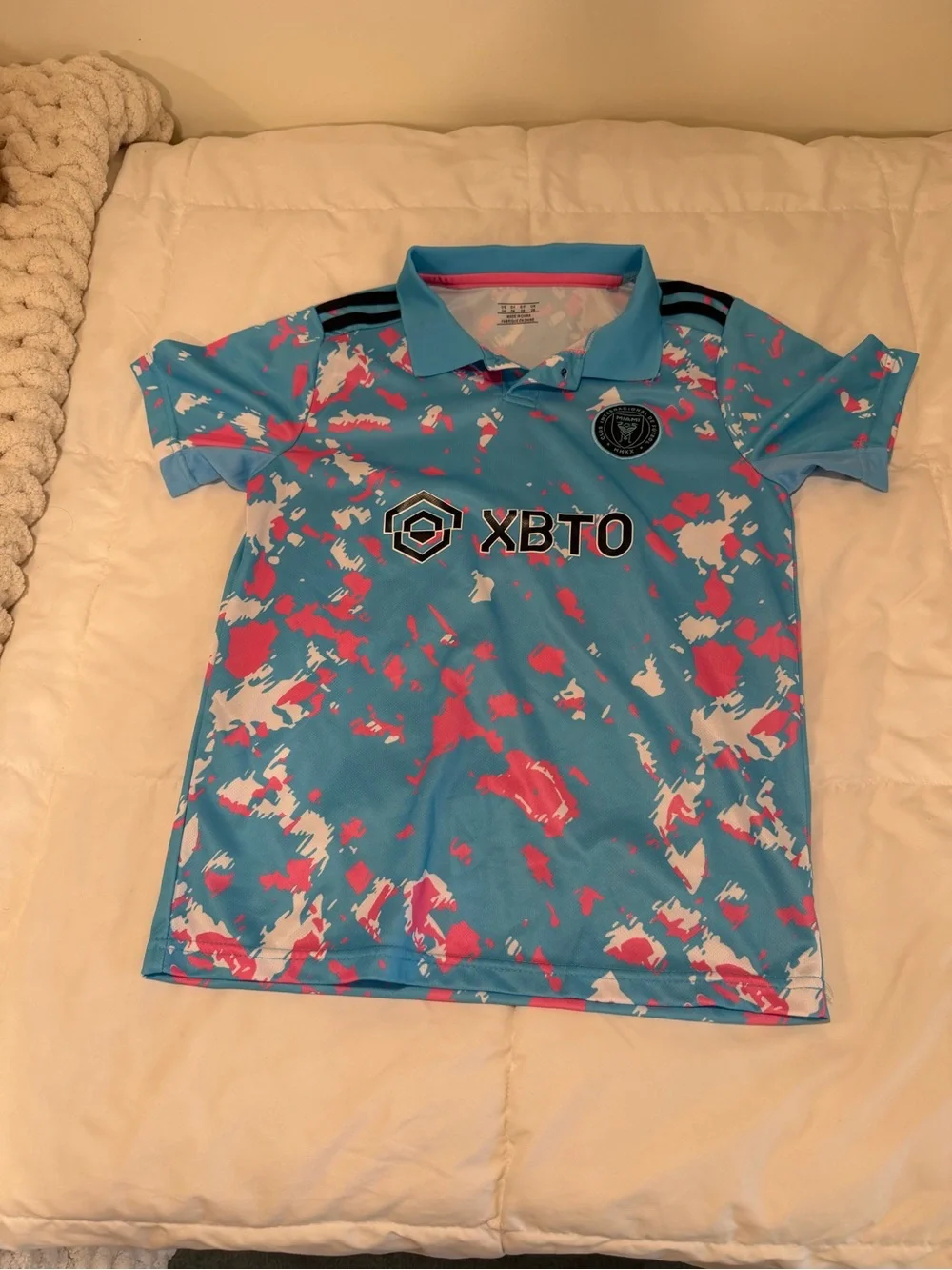Kids' Aqua Polo with Pink & White Splash Print, team copy Messi size Large